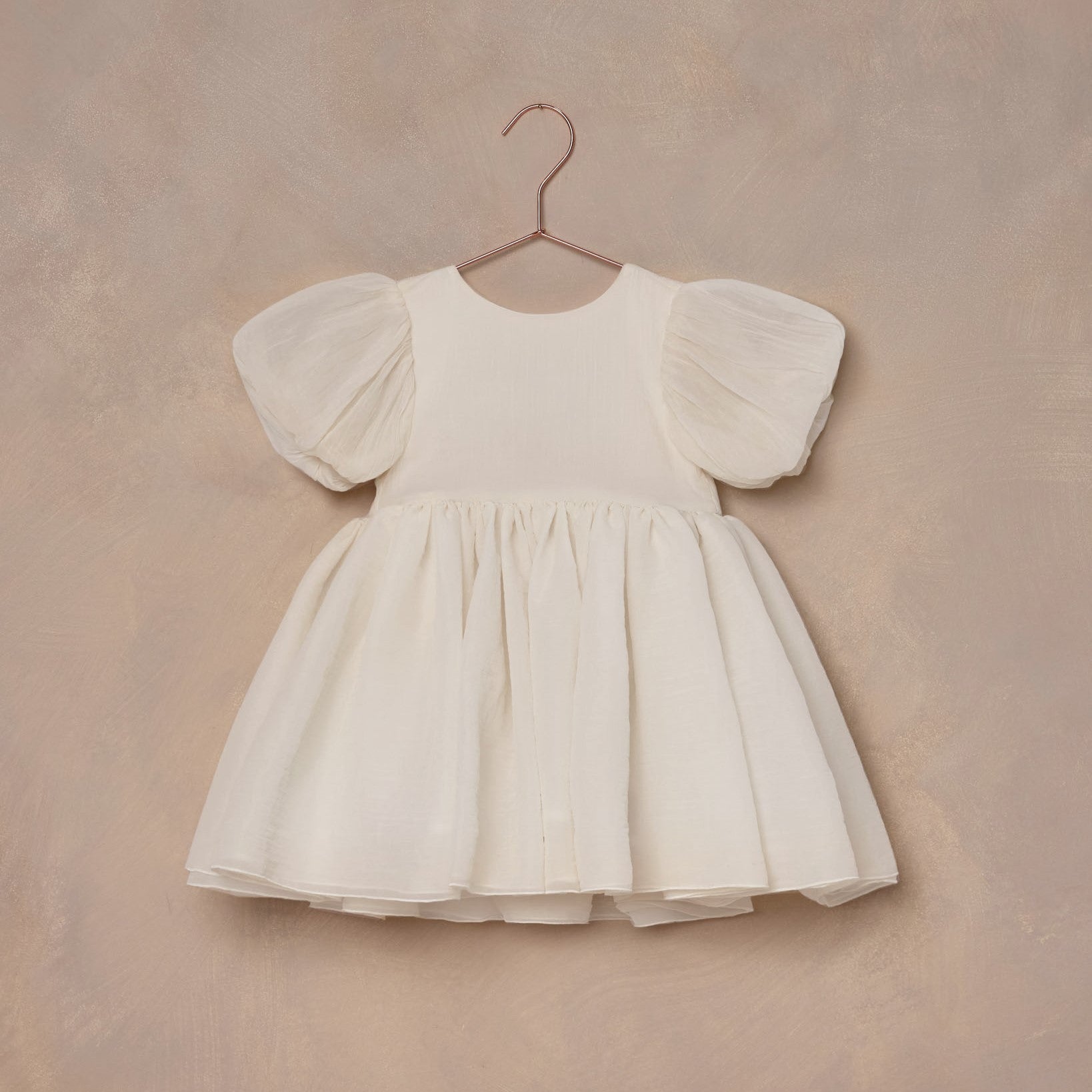 NORALEE Sofia Dress in Ivory with V-back, oversized puff sleeves, and layered organza tulle skirt. Includes matching bloomer for size 2y. ALWAYS SHOW