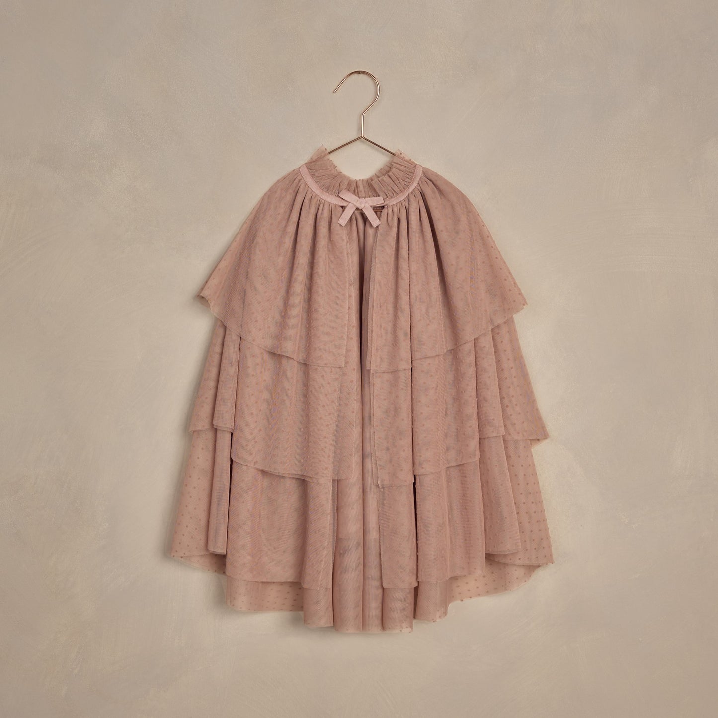 NORALEE Tulle Cape in dusty rose with ribbon detail and soft flocked tulle for parties or imaginative play.