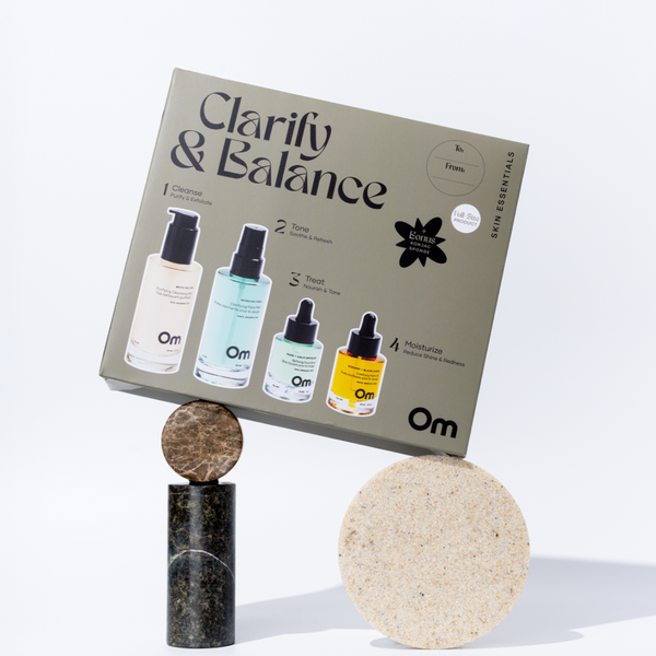 OM Organics Clarify and Balance skincare set featuring cleanser, face mist, elixir, face oil, and konjac sponge arranged together for oily and blemish-prone skin.