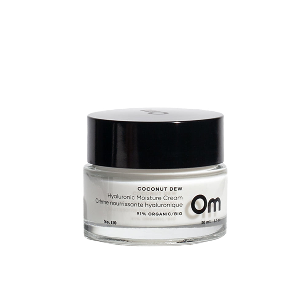 Om Organics Coconut Dew Hyaluronic Moisture Cream in a glass jar, a lightweight moisturizer for soft, hydrated skin.