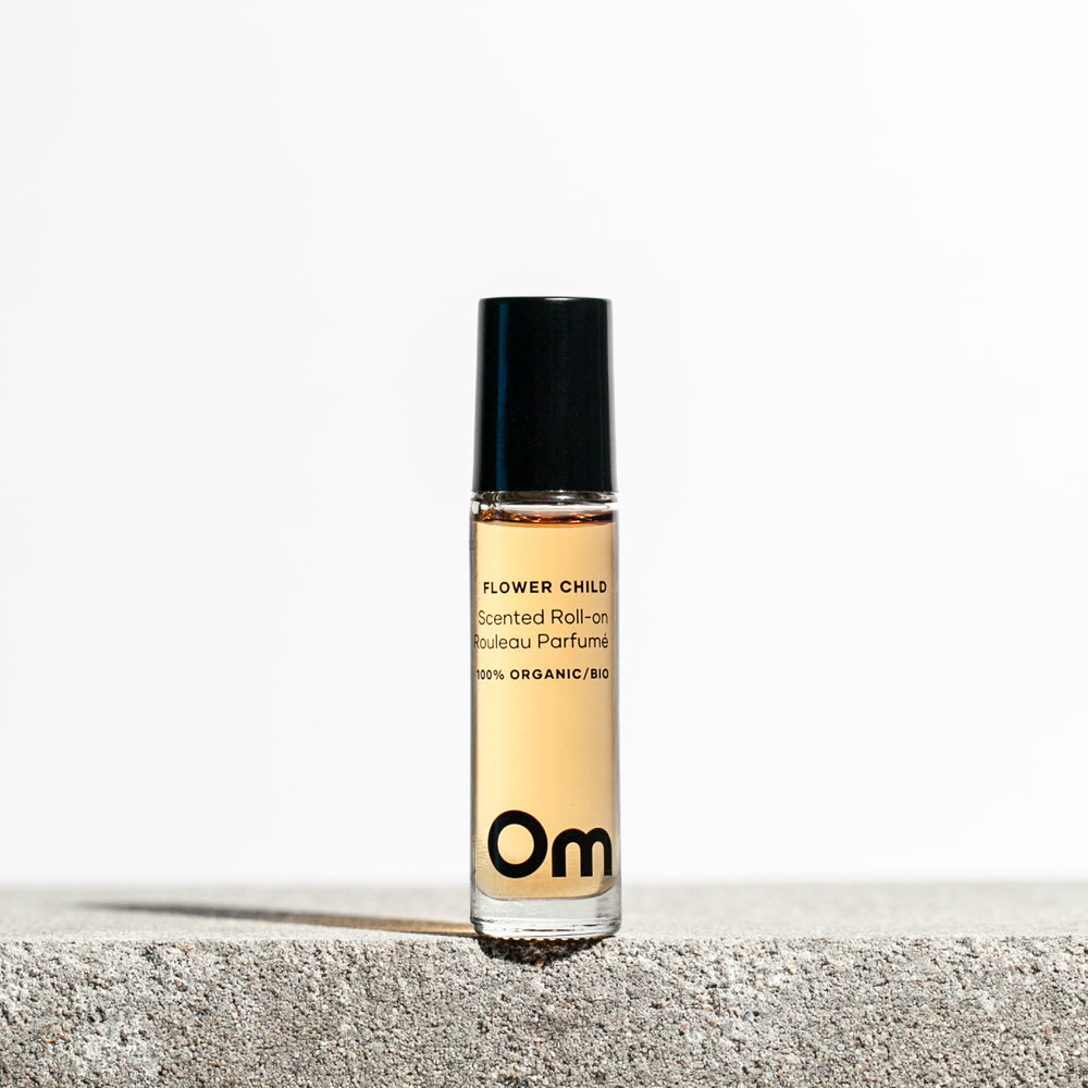 Om Organics Flower Child Scented Roll-On – a natural essential oil perfume with patchouli, sweet orange, neroli, and rosewood.