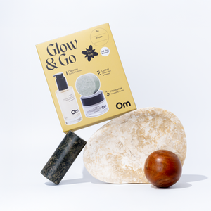 OM Organics Glow and Go set with facial cleanser, multi-use lather bar, and hydrating moisturizer arranged together for everyday skin and hair care.