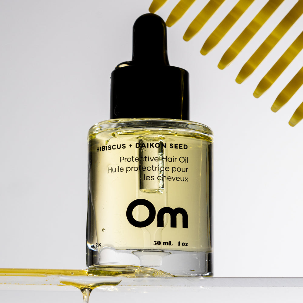 Om Organics Hibiscus + Daikon Seed Protective Hair Oil bottle, showcasing its lightweight formula for shine and softness.