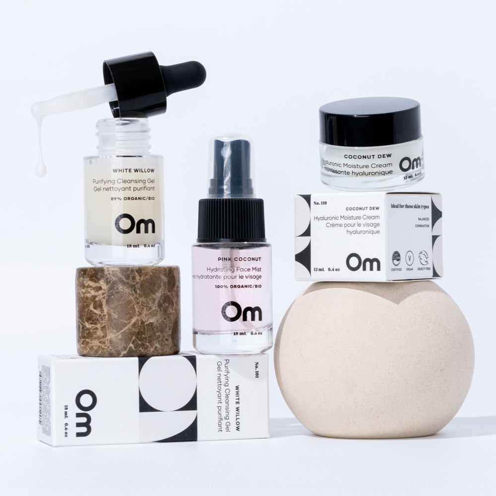 OM Organics Love At First Dew skincare set with mini cleanser, hydrating face mist, and moisturizer arranged together for a complete three-step routine.