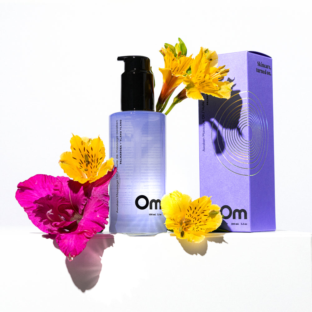 Om Organics Palmarosa + Ylang Ylang Awaken Massage Oil, a sensual blend of essential oils for deep hydration and relaxation. Features cinnamon, ylang ylang, and palmarosa for an inviting, soothing aroma.