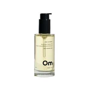 Bottle of OM Organics Pink Coconut Aromatic Body Oil with a blend of meadowfoam, jojoba, and olive squalane oils for soft, radiant skin.