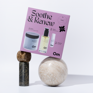 OM Organics Soothe & Renew set with Herb + Petal Bath Soak, Wild Plum + Cypress Body Oil, and Release Wellness Roll-On for a relaxing nighttime skincare ritual.