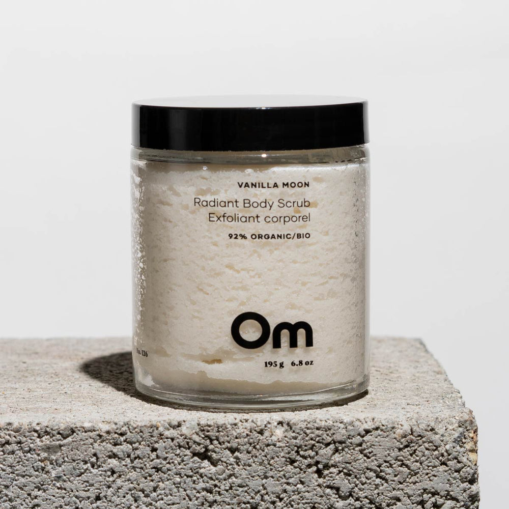 Om Organics Vanilla Moon Radiant Body Scrub in a jar, featuring a rich, exfoliating blend with coconut oil and vanilla essence for soft, glowing skin.