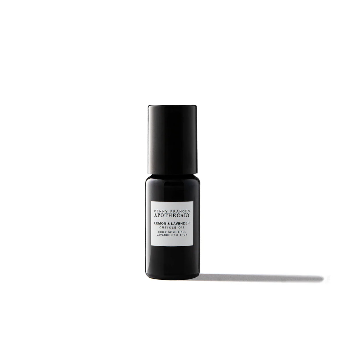 Bottle of Penny Frances Apothecary Lemon & Lavender Nail & Cuticle Oil with lavender sprigs, lemon, and natural botanical oils for nail care.