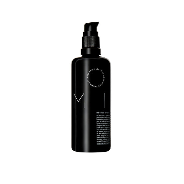 Bottle of REVERIE Milk Anti-Frizz Leave-In Nourishing Serum — a silicone-free, multi-tasking hair serum for all hair types that moisturizes, softens, and protects. full size