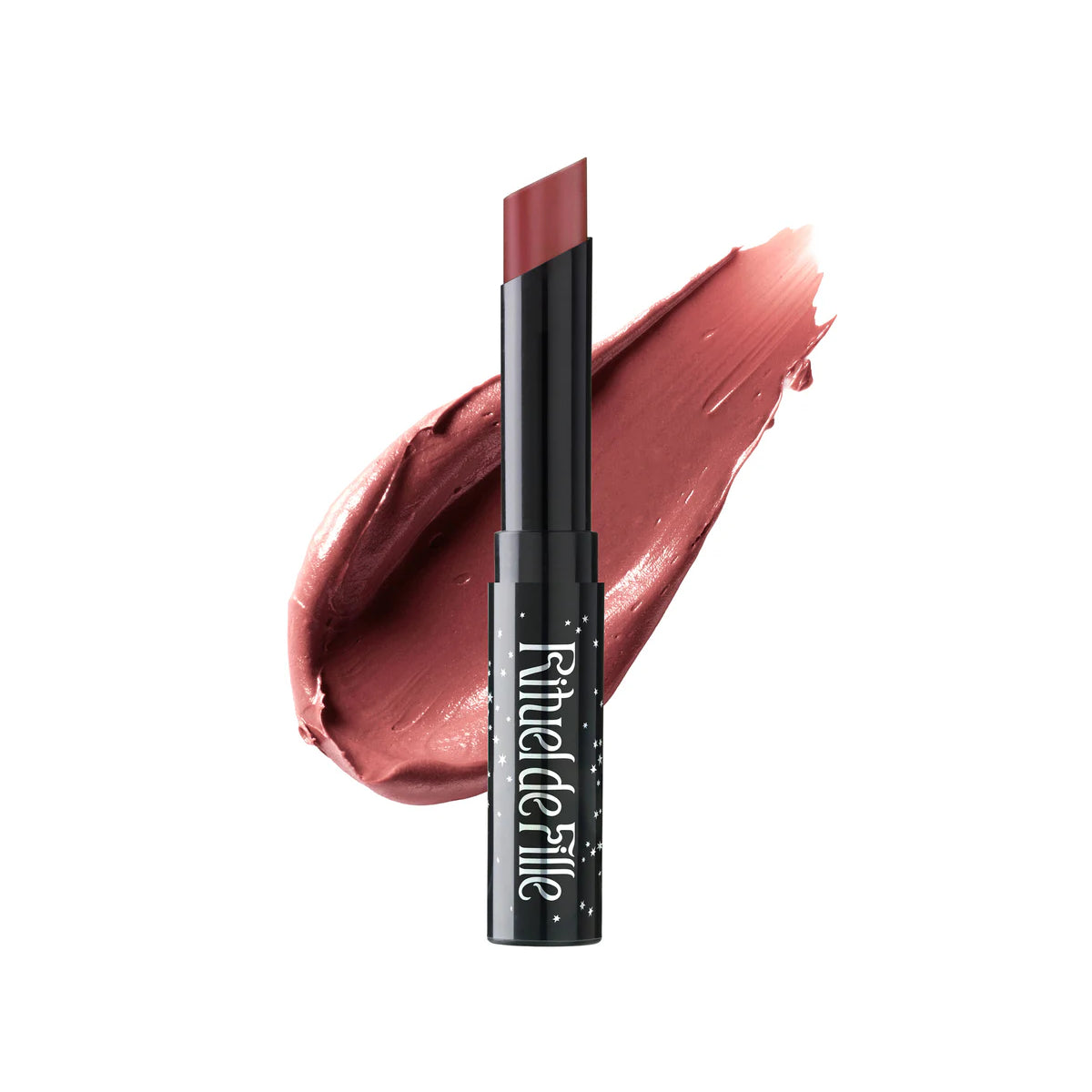 Rituel de Fille Enchanted Lip Sheer in Snakeroot, a semi-matte pink lipstick in a sleek black star-dusted tube, offering a your-lips-but-better shade.