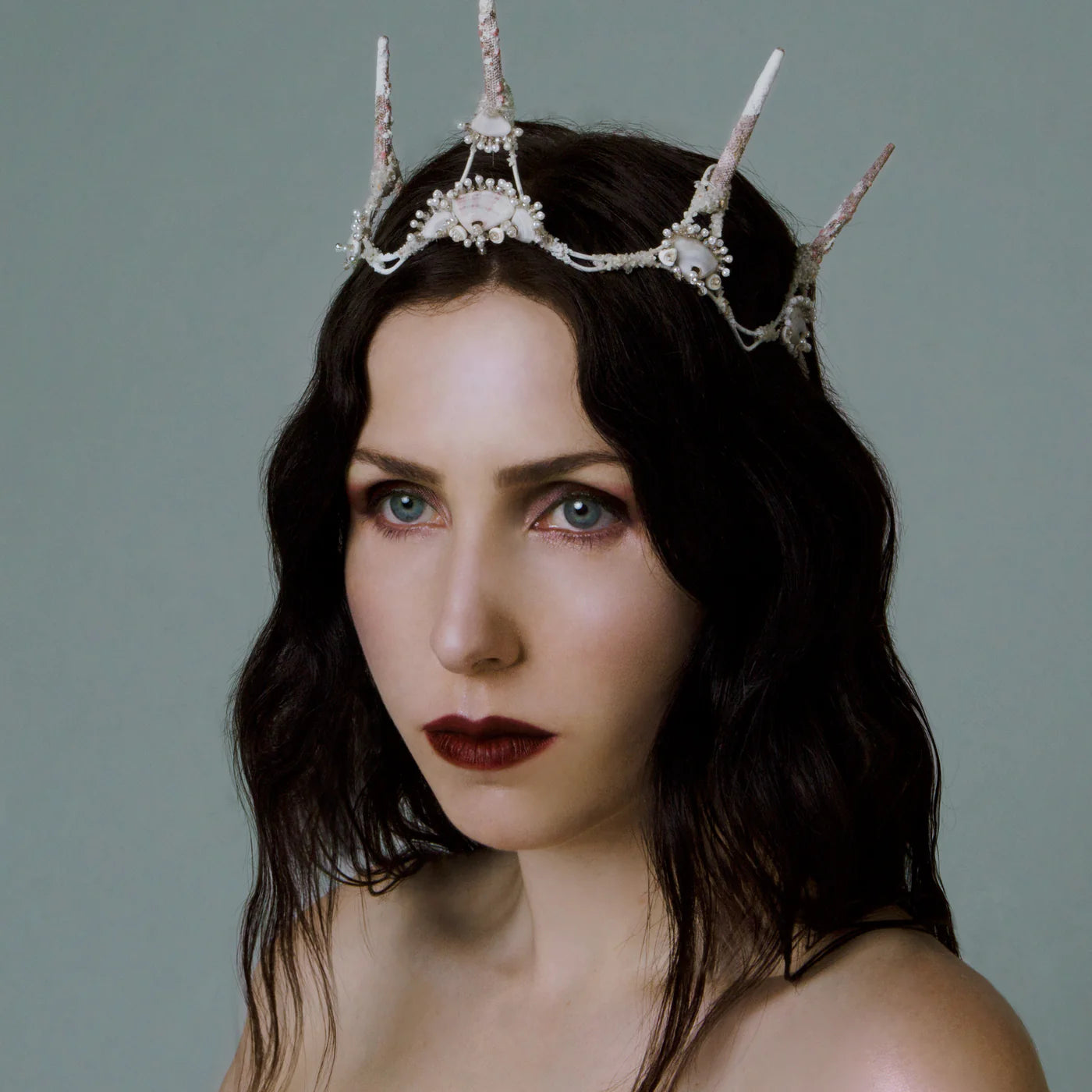 Woman wearing a decorative headpiece against a plain background. RITUEL DE FILLE Enchanted Lip Sheer Swarm