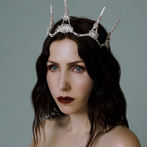 Woman wearing a decorative headpiece against a plain background. RITUEL DE FILLE Enchanted Lip Sheer Swarm