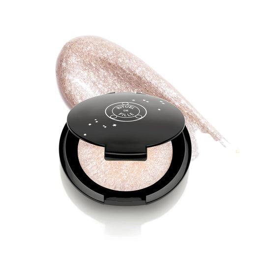 Rituel de Fille Highlight Intensifier in The Alchemist, packaged in a compact.