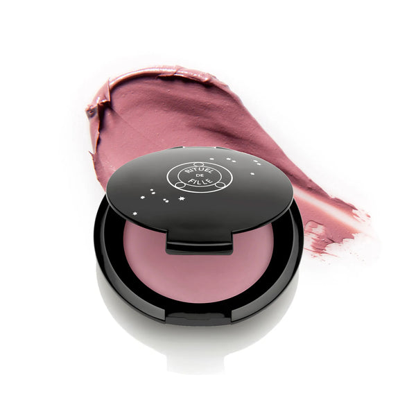 Rituel de Fille Inner Glow Crème Pigment in Desire, distinctive mauve shade in compact.