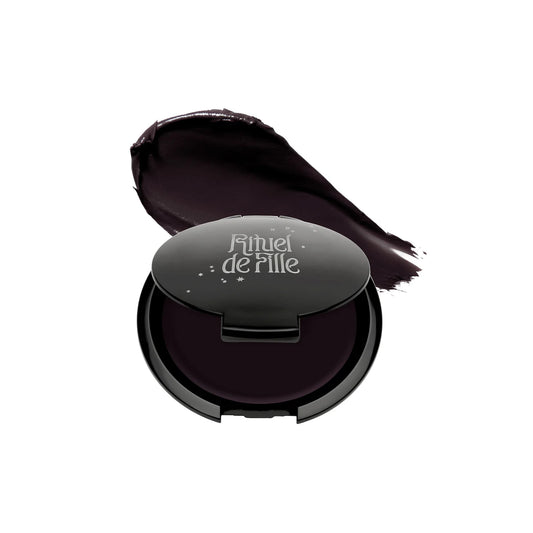 RITUEL DE FILLE Inner Glow Crème Pigment in Eclipse, a deep aubergine cream pigment in a starry black compact.