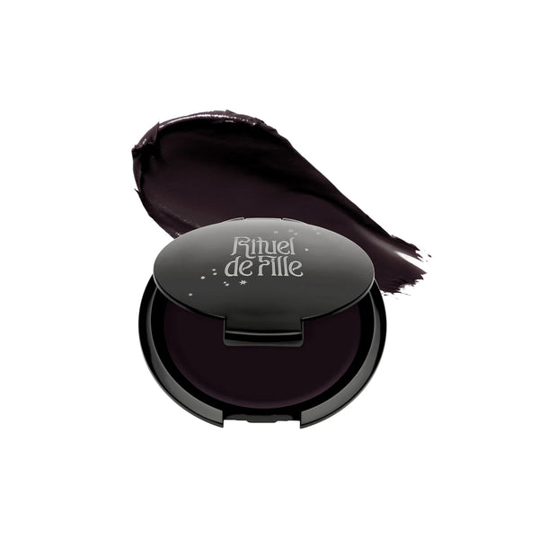 RITUEL DE FILLE Inner Glow Crème Pigment in Eclipse, a deep aubergine cream pigment in a starry black compact.