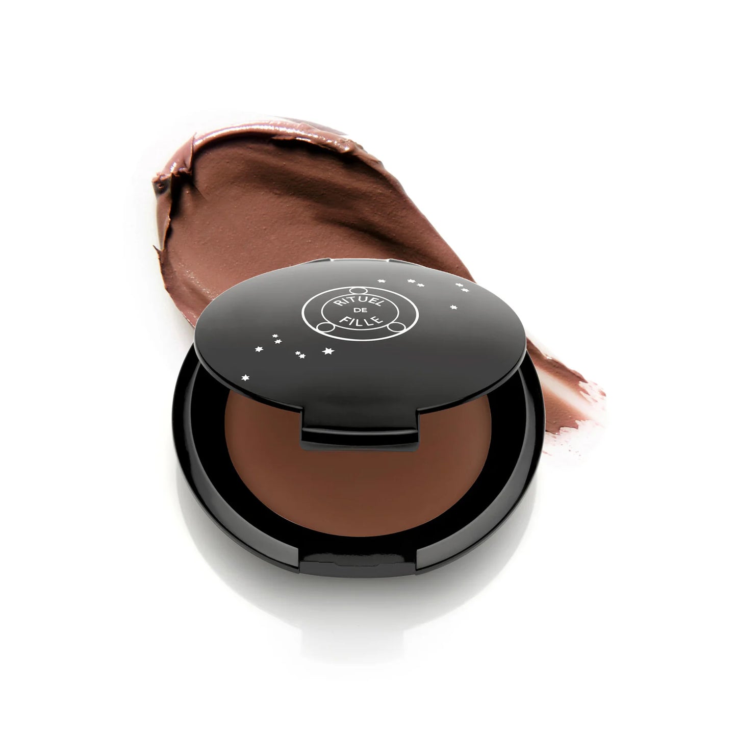 RITUEL DE FILLE Inner Glow Crème Pigment in Eros, a rosy sandy beige cream pigment in a sleek starry black compact.