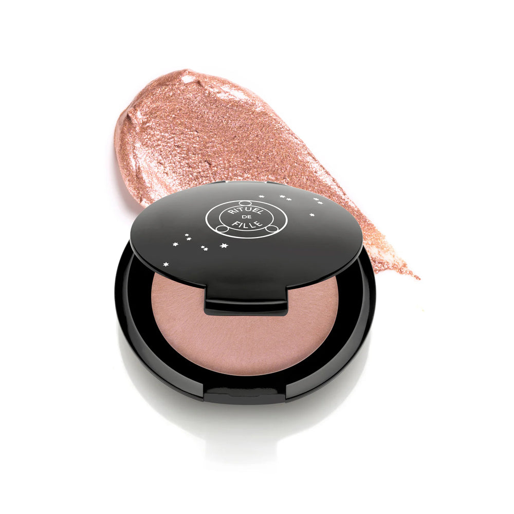 Rituel de Fille Rare Light Crème Luminizer in Phosphene, soft beige glow with peachy-blush shift in compact.