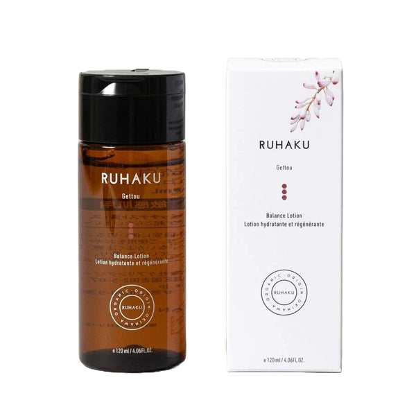 A bottle of Ruhaku Gettou Balance Lotion next to its white packaging box, featuring a black cap and amber brown bottle on a white background.