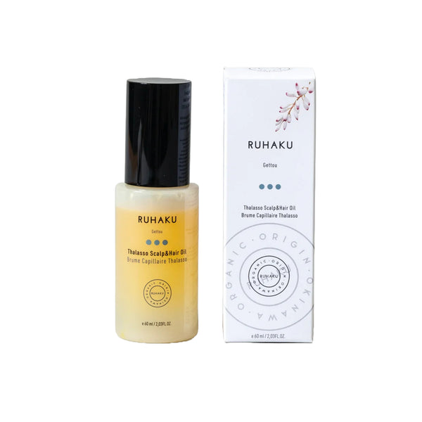Ruhaku Thalasso Scalp Hair Oil bottle with a black cap next to its white packaging box, shown on a plain white background.