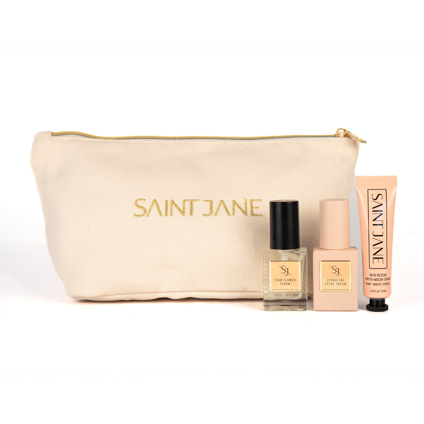 SAINT JANE Holiday Mini Set with Star Flower Serum, Hydrating Petal Cream, Rich Rescue Mucin Cream, and a gold makeup bag.