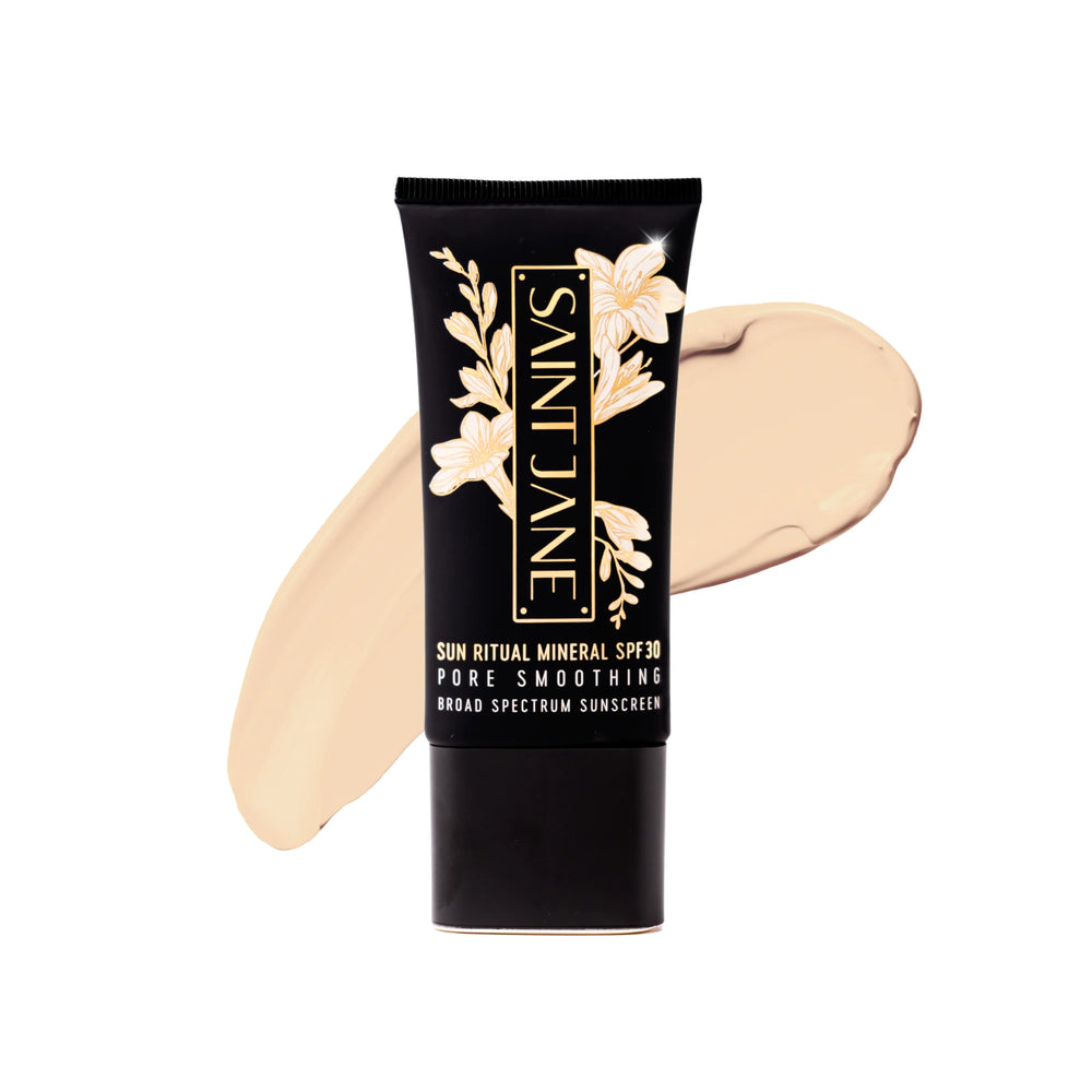 Saint Jane Sun Ritual Mineral SPF 30 sunscreen tube with a swatch on a white background