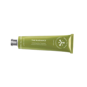 Green tube of 'The Radiance' exfoliating clay cleanser on a white background