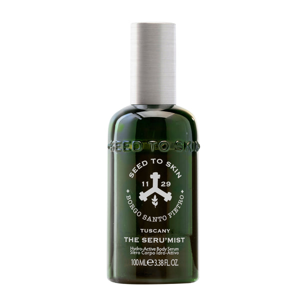 Seed to Skin Tuscany The Seru'mist hydro-active body serum in a dark green bottle with a white cap, on a white background.