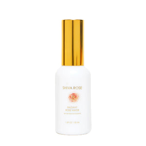 A white bottle of Shiva Rose Radiant Rose Water with a shiny gold cap, centered on a plain white background.