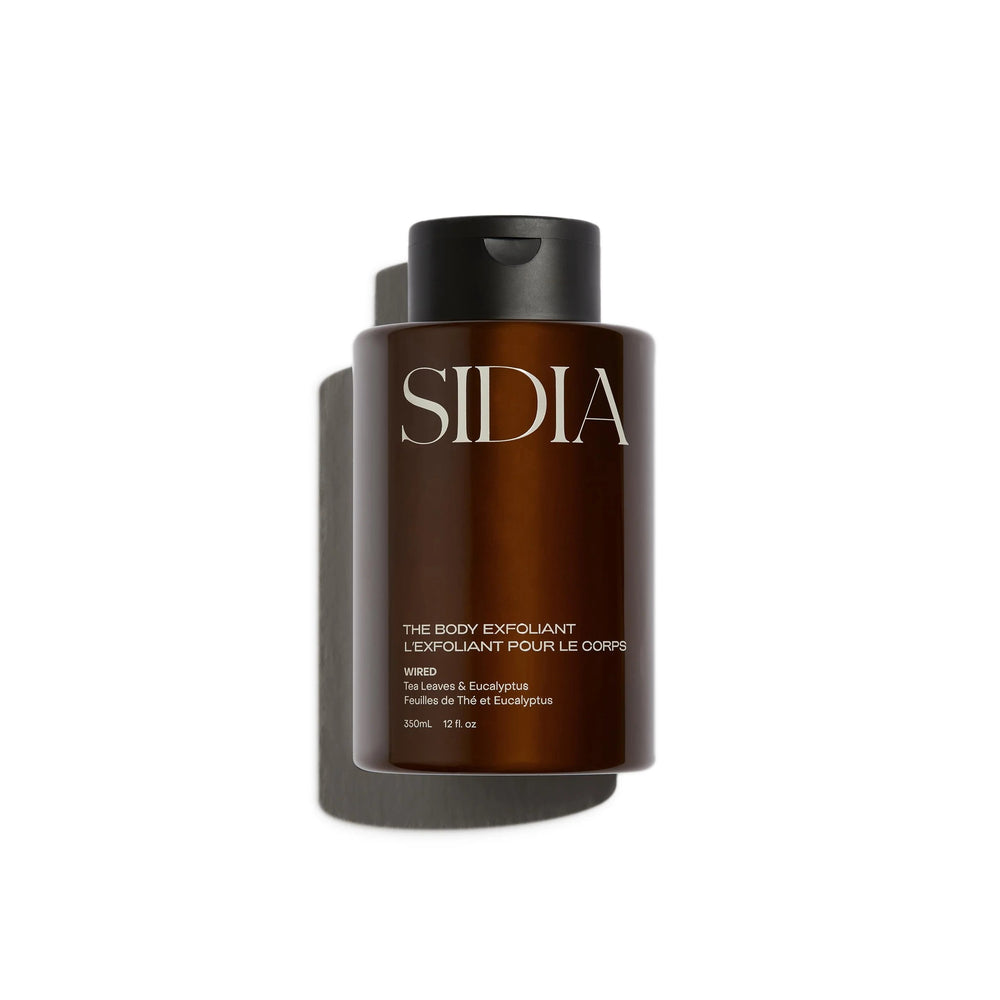 SIDIA The Body Exfoliant in a sleek bottle, featuring rice exfoliators, bakuchiol, and niacinamide for smoother, refreshed skin.