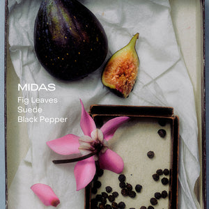 Fig, pink flower, and black peppercorns on a textured surface with 'Midas' branding.