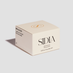 Sidia solid perfume packaging on a light gray background