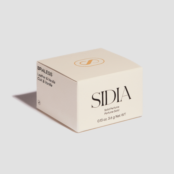 Sidia solid perfume packaging on a light gray background