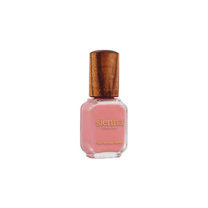 Sienna Byron Bay Glowing Nail Polish in a warm midtone peachy pink crème shade with sustainable packaging.