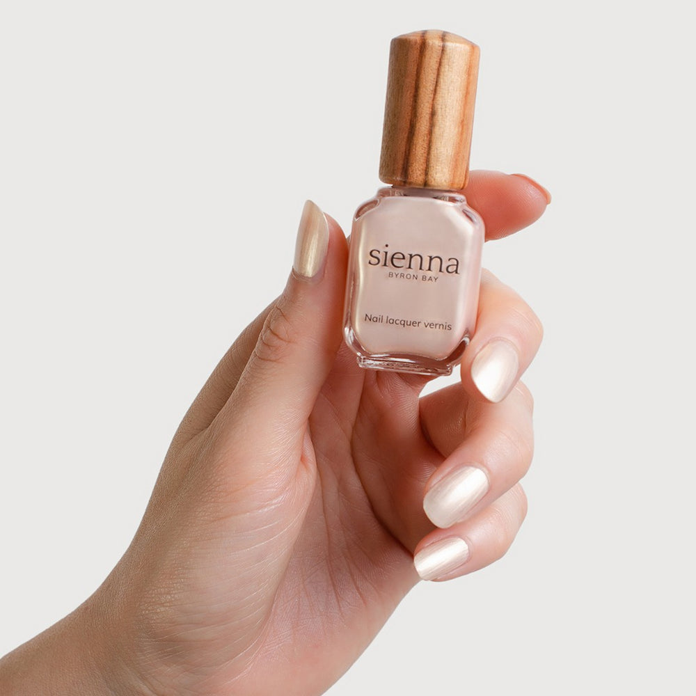 Sienna Byron Bay Lullaby Nail Polish - warm ivory pearl with a frosted finish in an eco-friendly bottle.