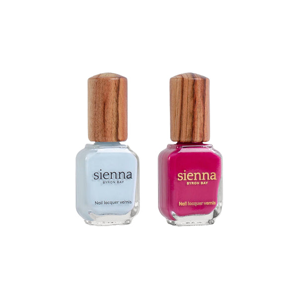 Sienna Byron Bay Seaside Duo – a coastal-inspired nail polish set featuring Wategos (pastel blue crème) and Goddess (bold raspberry crème) in eco-friendly packaging.