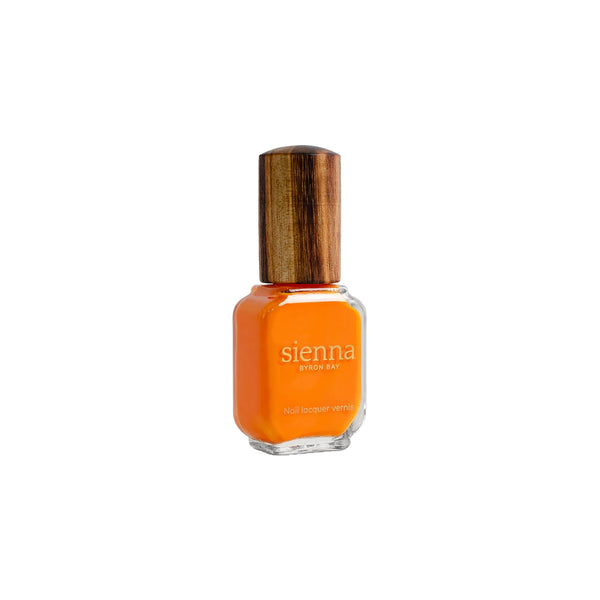 Sienna Byron Bay Warmth Nail Polish in a radiant ripe papaya crème shade with sustainable packaging.