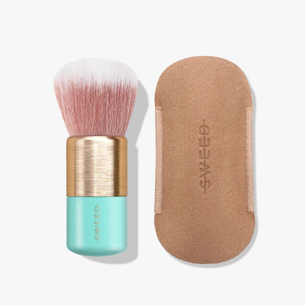 Makeup brush with a turquoise handle and gold accents on a white background