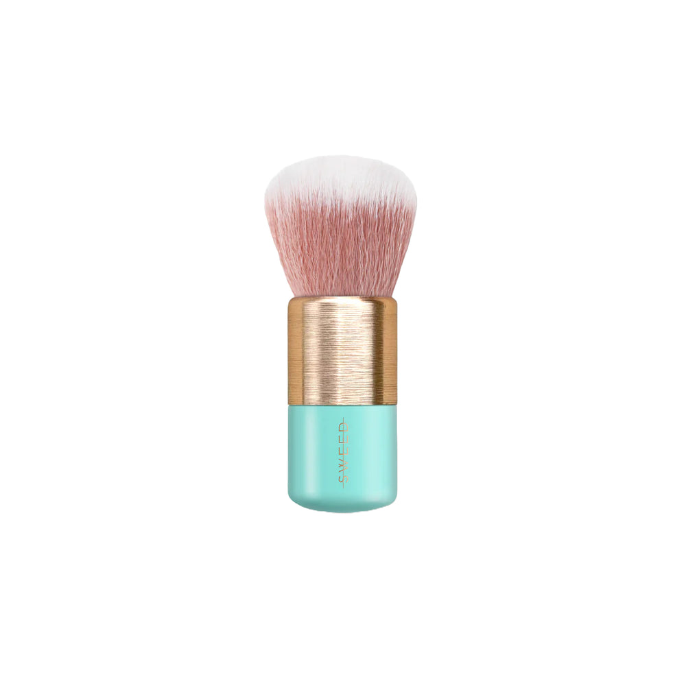 Makeup brush with a turquoise handle and gold accents on a white background