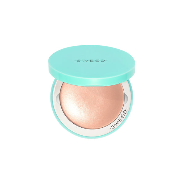 Compact highlighter with teal lid and case on a white background