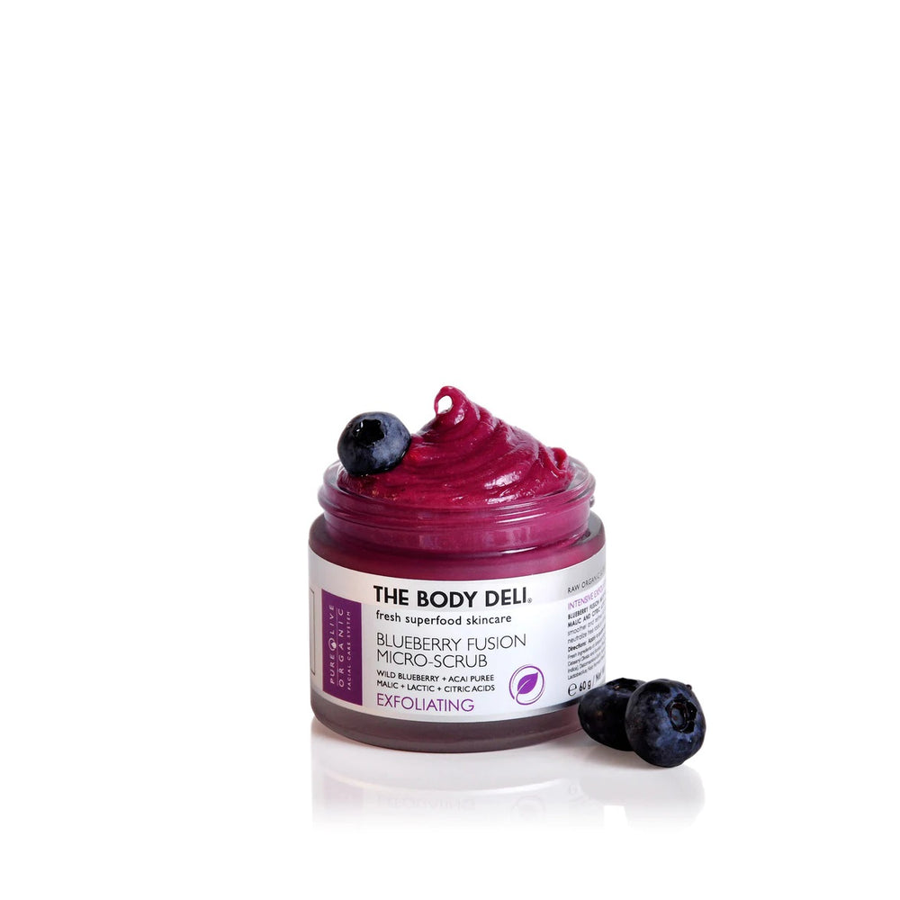 THE BODY DELI BLUEBERRY FUSION Scrub – antioxidant-rich exfoliating facial scrub with blueberry and acai, featuring natural fruit acids and fine earth particles in a 2oz jar.
