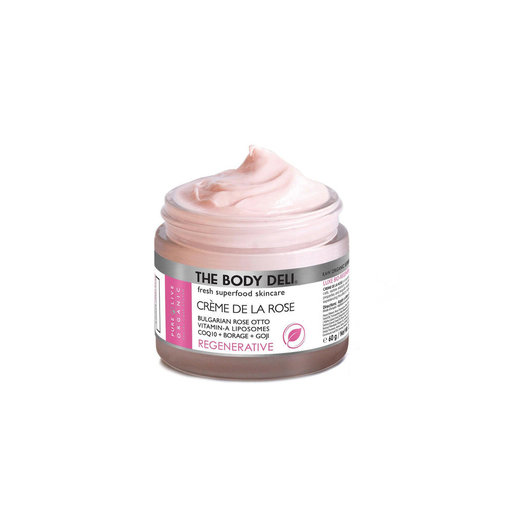Jar of THE BODY DELI Crème de la Rose facial moisturizer on a white background.