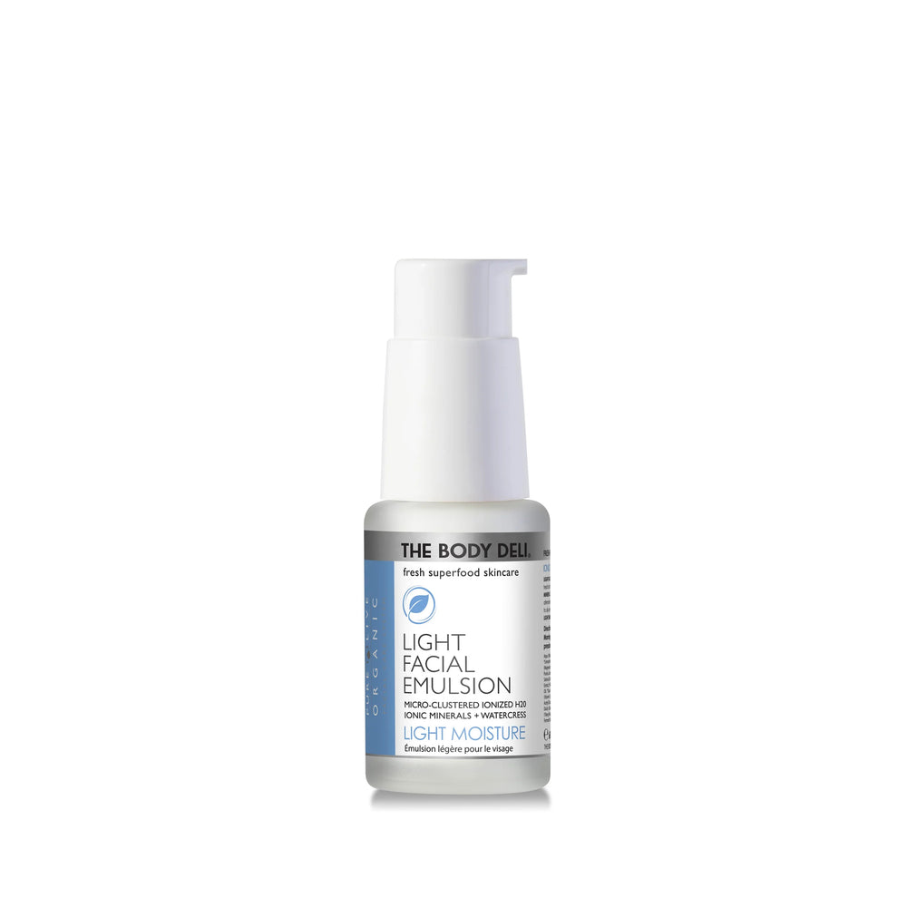 THE BODY DELI LIGHT Facial Emulsion bottle with white pump  on a white background.