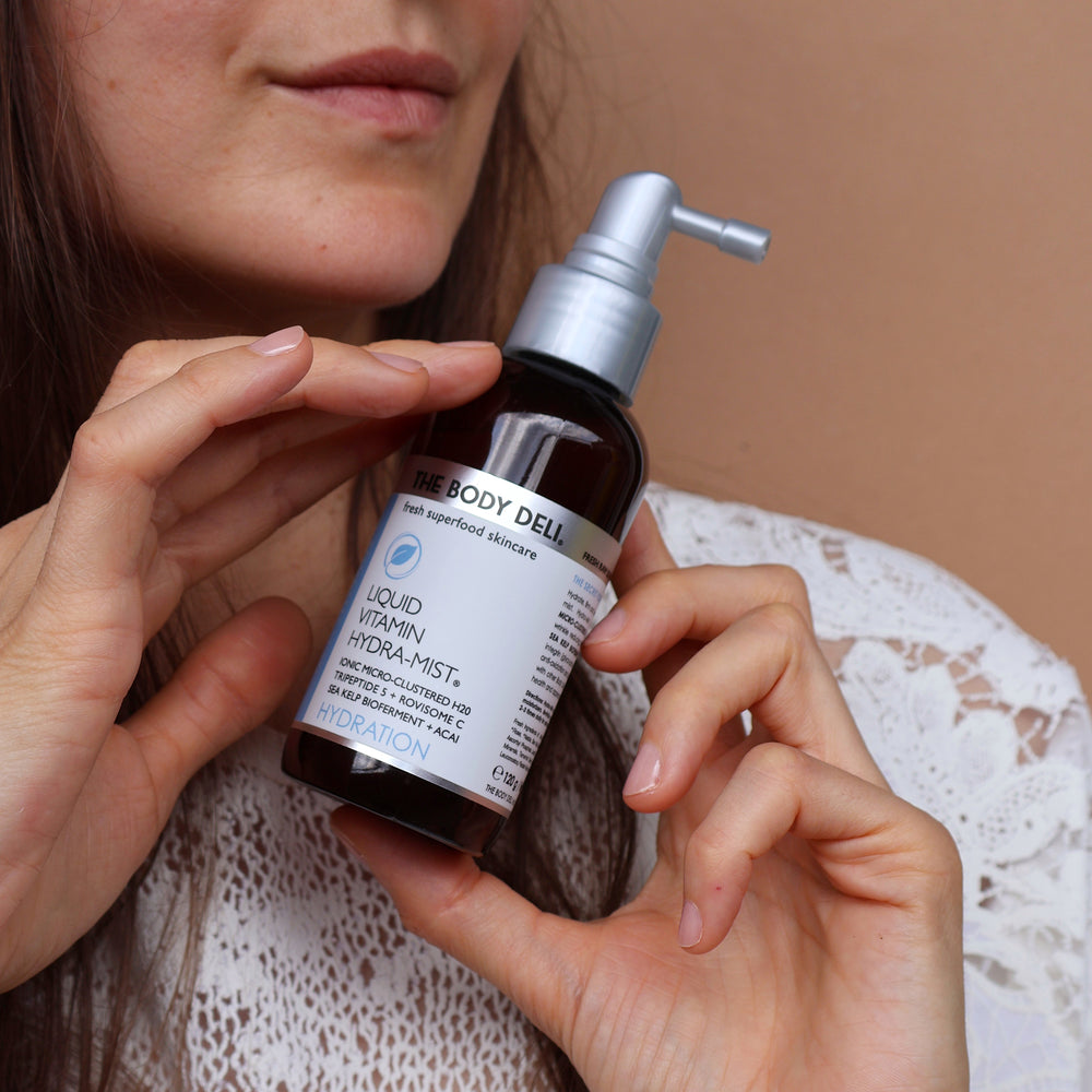 THE BODY DELI LIQUID VITAMIN Hydra-Mist bottle photographed on a white background.