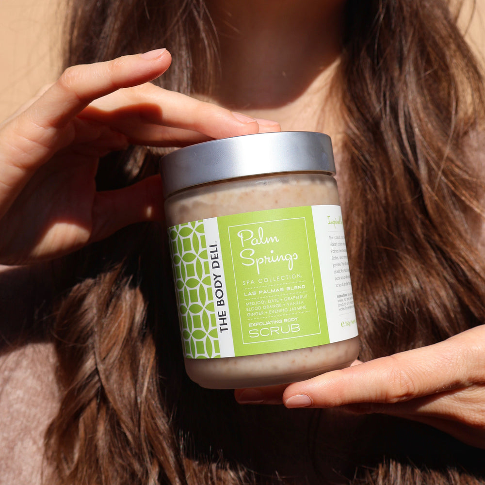 THE BODY DELI PALM SPRINGS Exfoliating Scrub – glass jar displayed against a white background.