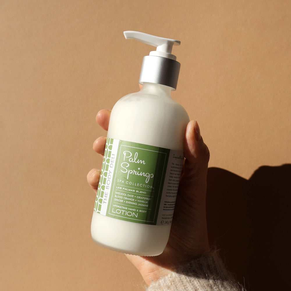 THE BODY DELI PALM SPRINGS Hand & Body Lotion – glass pump bottle with displayed on white background.