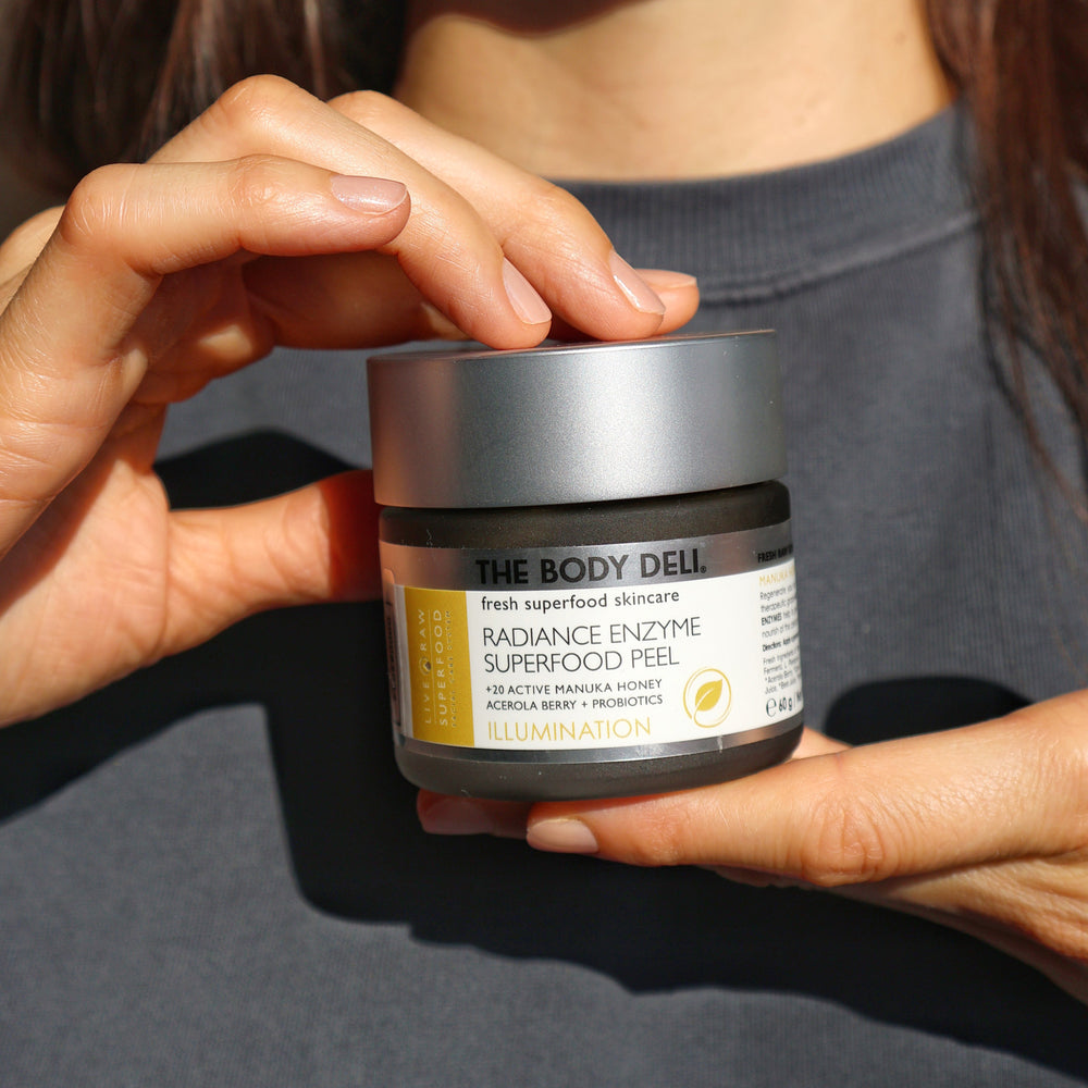 Jar of THE BODY DELI RADIANCE ENZYME SUPERFOOD Peel – a Manuka honey-based exfoliating mask with plant enzymes and vibrant green superfoods.