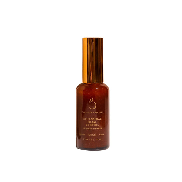 The Golden Secrets Aphrodisiac Glow Oil, a nourishing bronzing body oil that deeply hydrates and enhances your natural glow with a subtle tint. Featuring a blend of jasmine, mandarin, coconut oil, and golden mica, this high vibrational oil nourishes and smooths the skin, leaving a radiant appearance. Perfect for use on the body, face, and hair, it provides a luminous golden glow without DHA or synthetic fragrance. Think Dirty Verified, this versatile oil hydrates and nourishes for a youthful, balanced look.