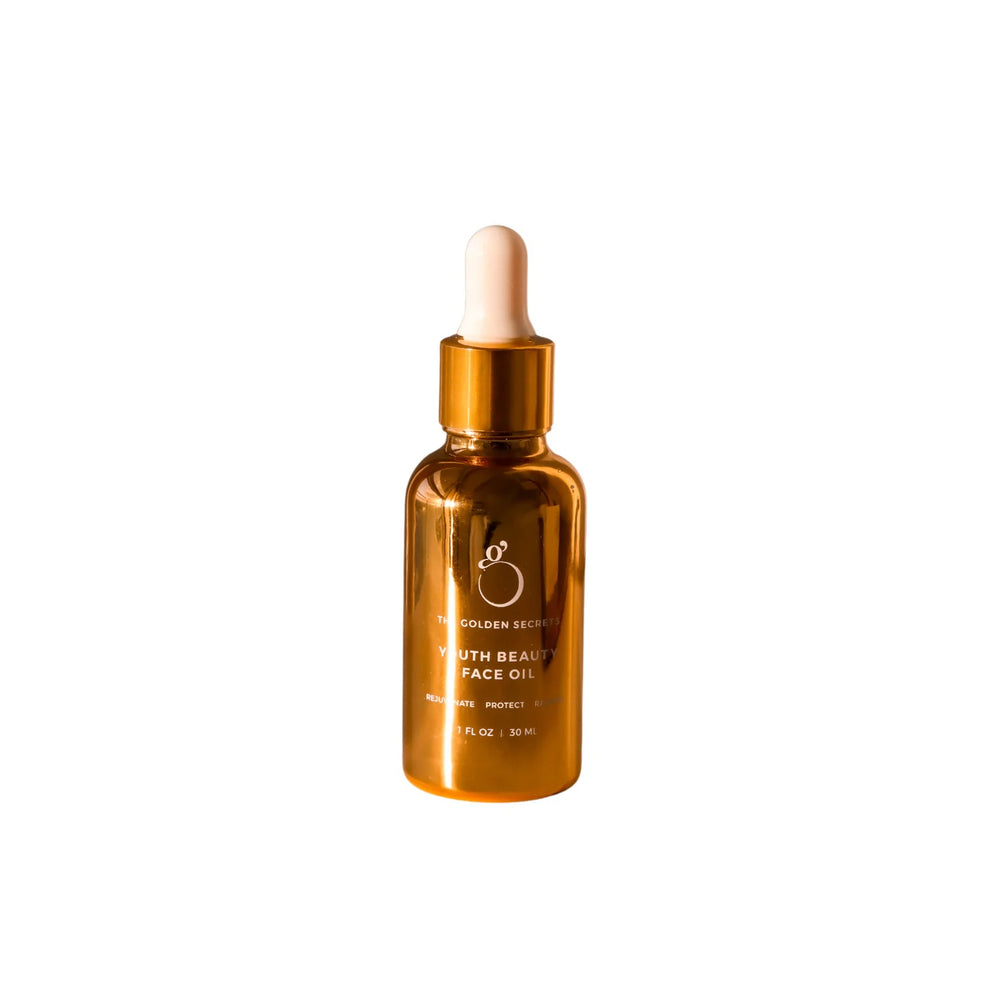 The Golden Secrets Youth Beauty Face Oil, an organic, nutrient-rich facial oil that rejuvenates, protects, and radiates a youthful glow. Infused with botanical ingredients like helichrysum, carrot seed, frankincense, and jojoba oil, it nourishes and enhances skin texture for a smoother, revitalized complexion.